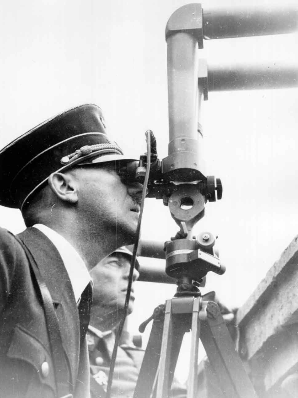 Hitler looking through a periscope